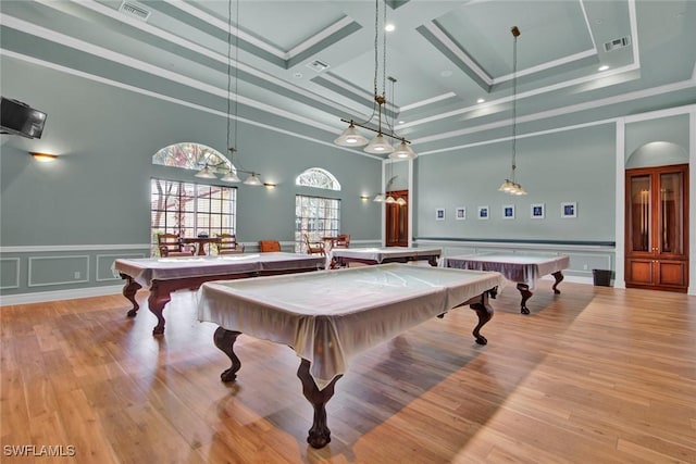 recreation room with a high ceiling, light wood-type flooring, and billiards