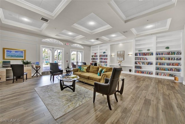 living room with coffered ceiling, french doors, light hardwood / wood-style flooring, built in features, and beamed ceiling