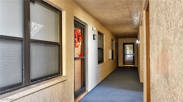 corridor featuring concrete flooring