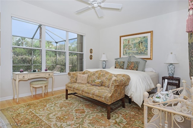 bedroom featuring hardwood / wood-style floors and ceiling fan