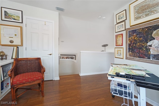 living area with dark hardwood / wood-style flooring