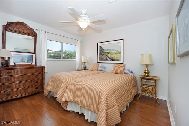 bedroom featuring ceiling fan and dark hardwood / wood-style flooring