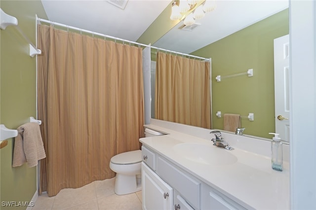 bathroom with tile patterned floors, vanity, a shower with shower curtain, and toilet