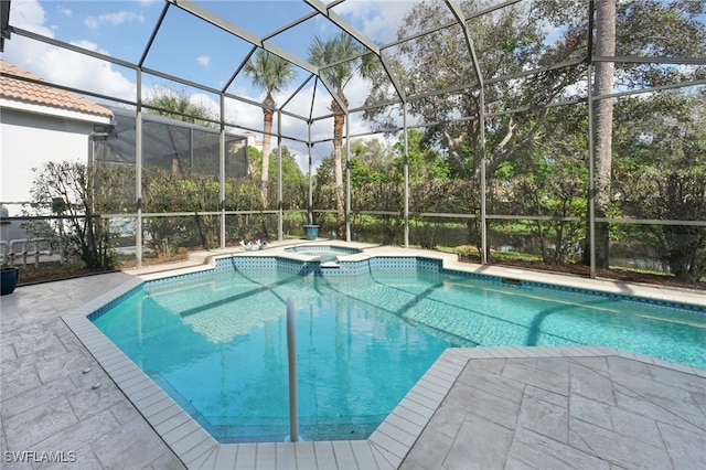 view of swimming pool with a lanai, an in ground hot tub, and a patio