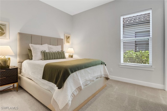 bedroom with light colored carpet