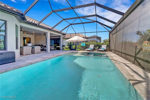 view of swimming pool with glass enclosure, ceiling fan, an outdoor living space, and a patio