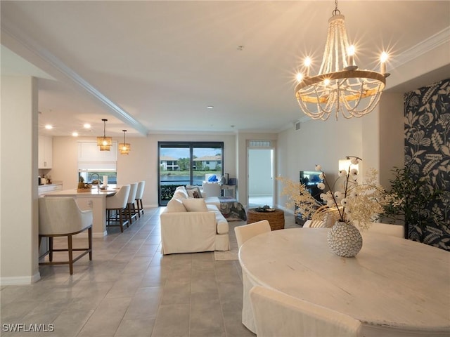 dining area with ornamental molding and a chandelier