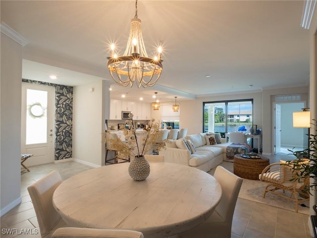 tiled dining space featuring crown molding and a notable chandelier