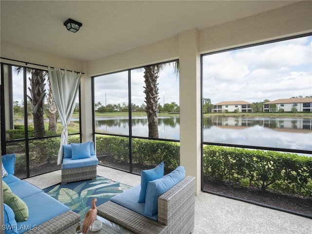 sunroom / solarium with a water view