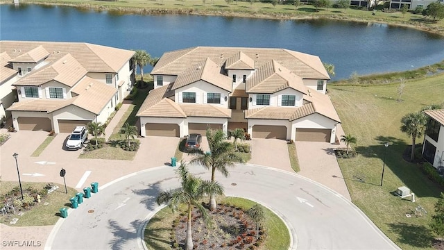 drone / aerial view with a water view