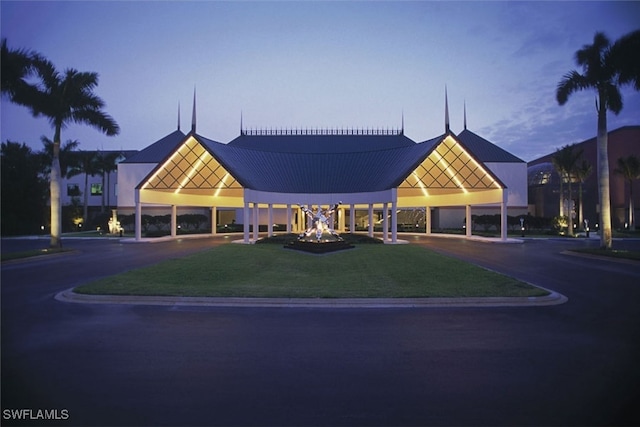 view of outdoor building at dusk