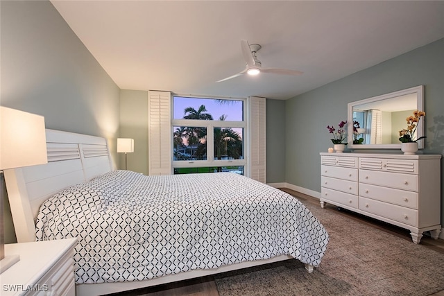 bedroom featuring ceiling fan and dark hardwood / wood-style floors