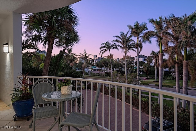 view of balcony at dusk