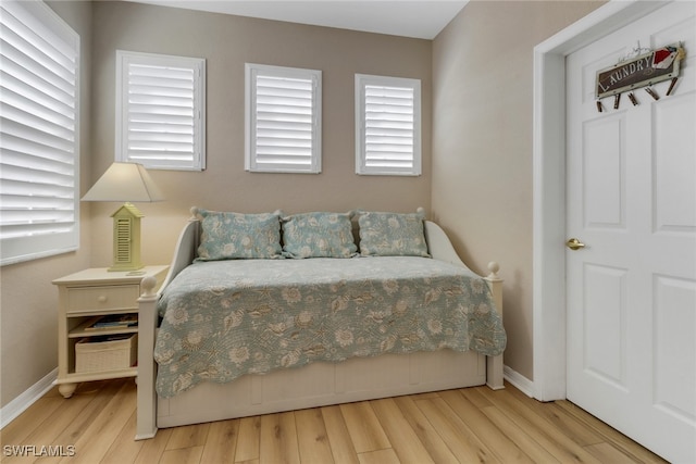 bedroom with light wood-type flooring