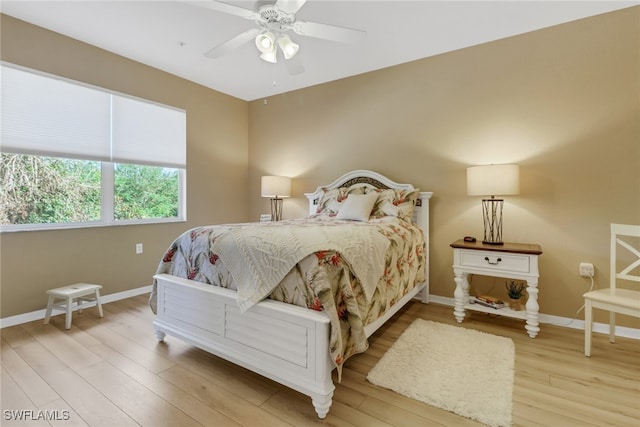 bedroom featuring hardwood / wood-style flooring and ceiling fan