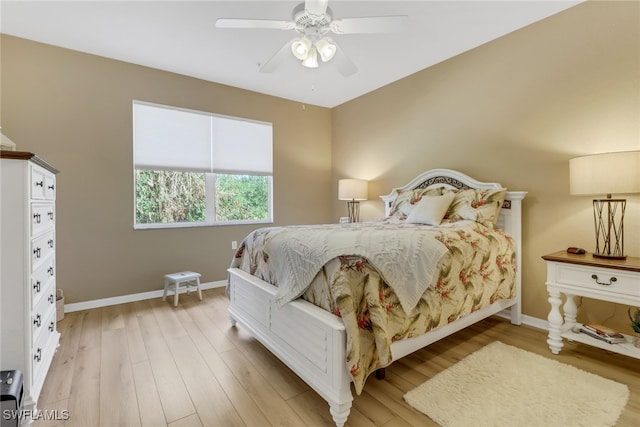 bedroom with light wood-type flooring and ceiling fan