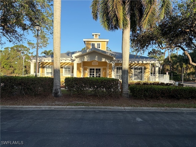 view of front of house featuring a pergola