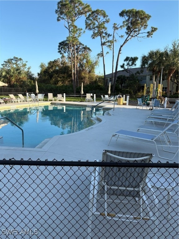 view of swimming pool with a patio area