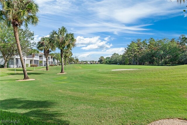 view of home's community featuring a lawn