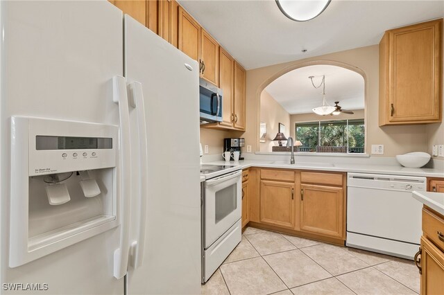 kitchen featuring sink, decorative light fixtures, white appliances, ceiling fan, and light tile patterned floors