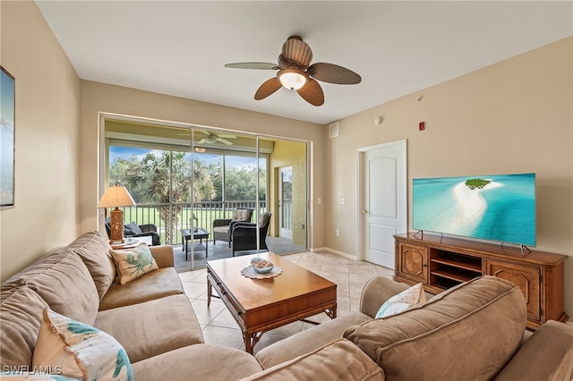 living room with ceiling fan and light tile patterned floors