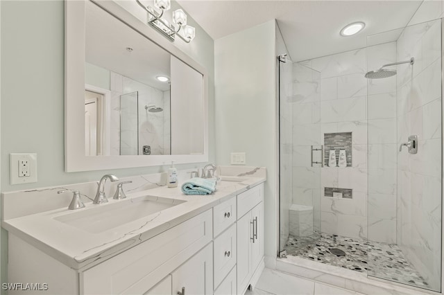 bathroom featuring vanity and a shower with shower door