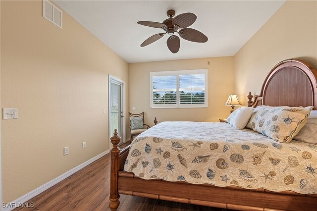 bedroom featuring ceiling fan and dark hardwood / wood-style floors