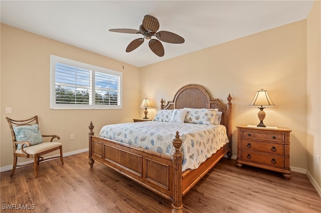 bedroom with wood-type flooring and ceiling fan