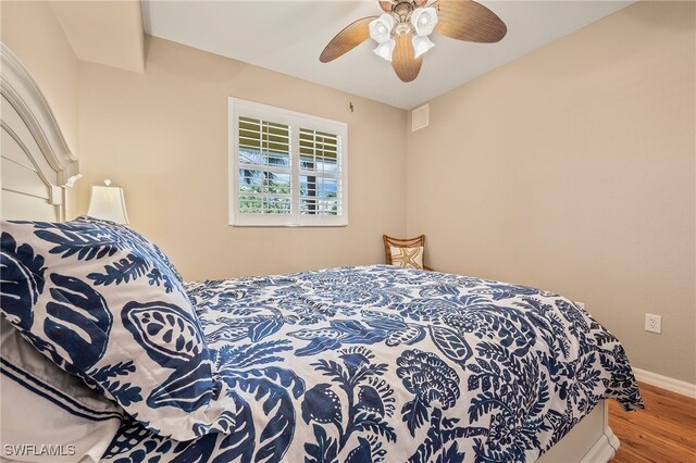 bedroom featuring hardwood / wood-style floors and ceiling fan