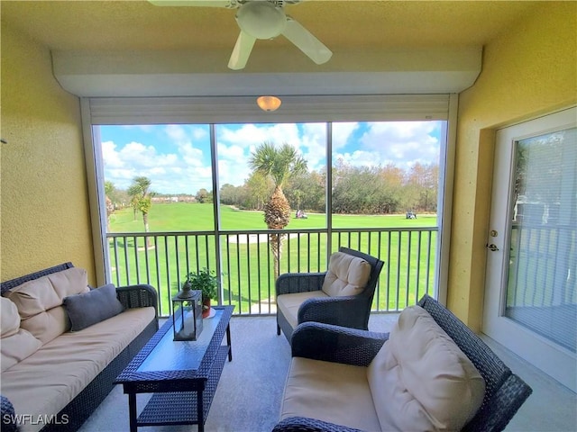 sunroom / solarium with ceiling fan and a healthy amount of sunlight