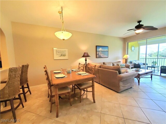 living room featuring ceiling fan and light tile patterned floors