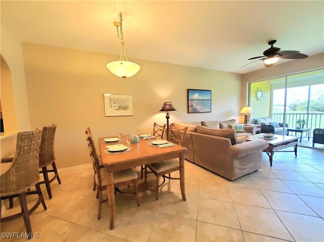 dining room featuring light tile patterned flooring and ceiling fan
