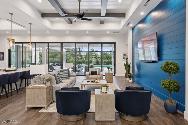 living room featuring ceiling fan, beam ceiling, and dark hardwood / wood-style flooring