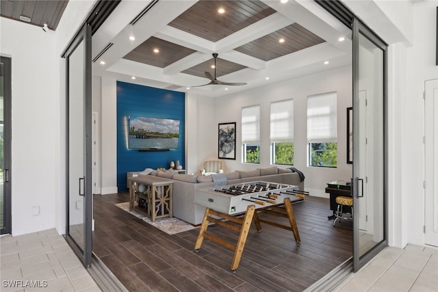 game room with coffered ceiling, wooden ceiling, beamed ceiling, and light hardwood / wood-style flooring