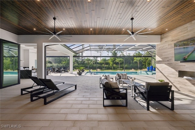 view of patio / terrace with a lanai and ceiling fan