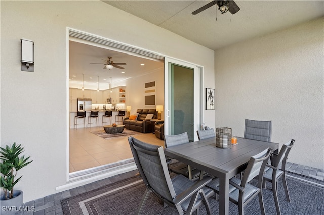 view of patio featuring ceiling fan