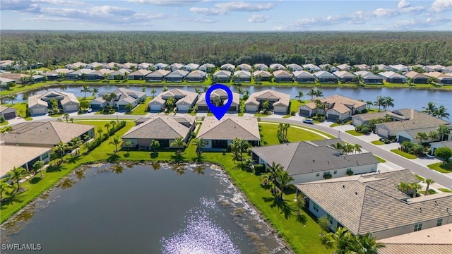 birds eye view of property featuring a residential view and a water view