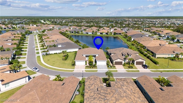 bird's eye view with a residential view and a water view