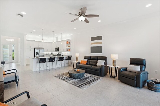 living area with light tile patterned flooring, visible vents, recessed lighting, and ceiling fan