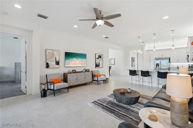 living room with a ceiling fan, light tile patterned flooring, recessed lighting, and visible vents