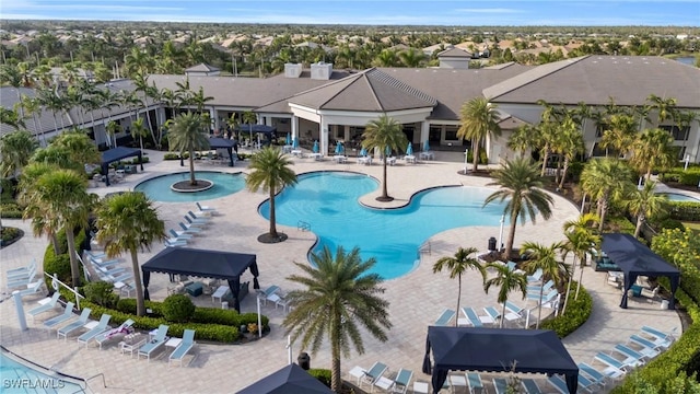 community pool featuring a patio area and a residential view