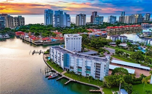 aerial view at dusk with a water view