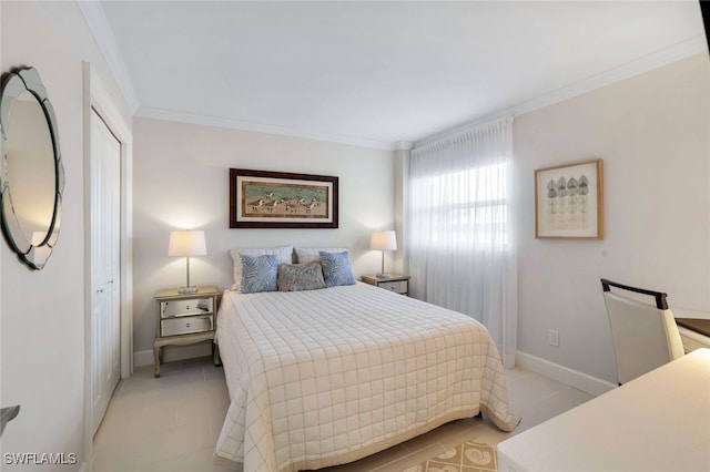 tiled bedroom featuring crown molding and a closet