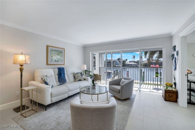 living room with ornamental molding and a water view