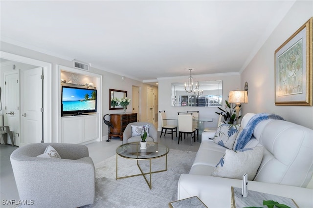 living room featuring crown molding and a chandelier