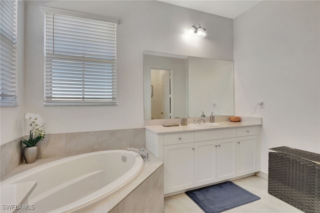 bathroom featuring vanity, tiled bath, and tile patterned floors