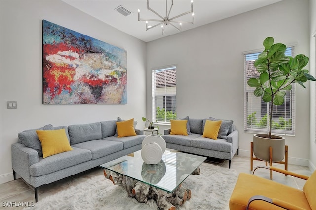 living room with an inviting chandelier