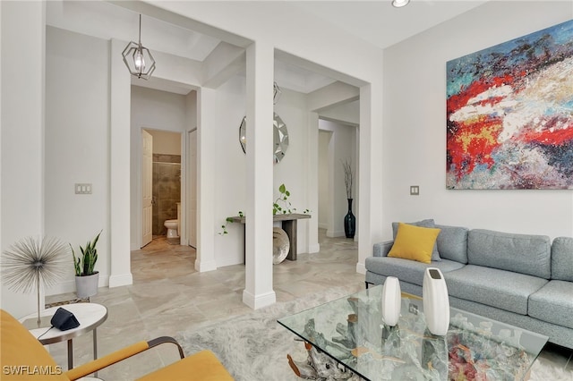 living room with a notable chandelier