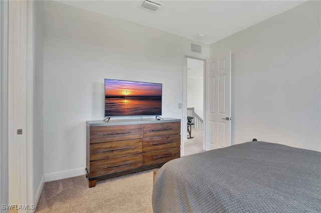 bedroom with light carpet