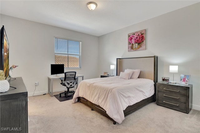 bedroom with light carpet